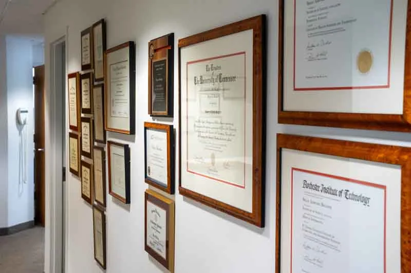 credentials lining the walls of Brodine Prosthodontics