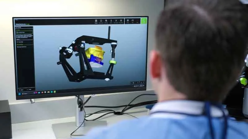 Dr. Brodine building a dental model for a patient