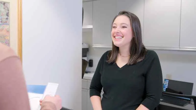 patient smiling at Brodine Prosthodontics